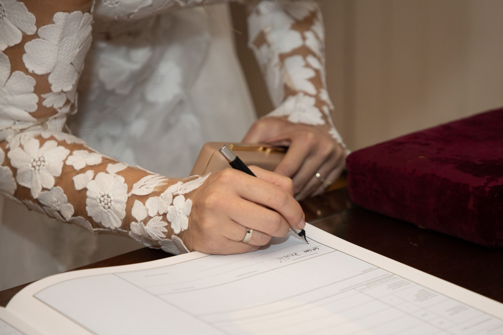 Valencia 12 Bride signing the marriage register during a legal ceremony in Valencia & Surroundings, Spain